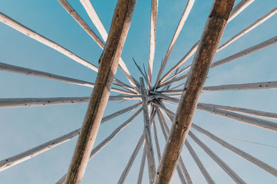 Low angle view of palm tree against blue sky