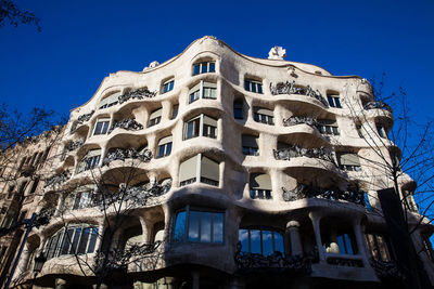 Low angle view of building against blue sky