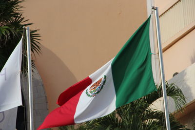 Close-up of flags hanging against the sky