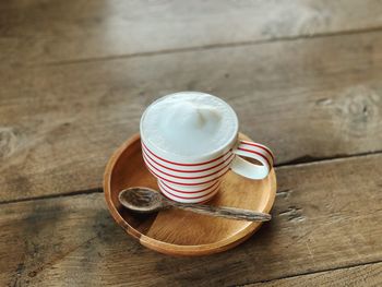 High angle view of coffee cup on table