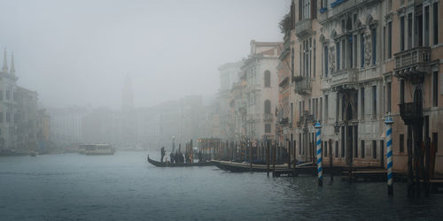 Boats in canal in city