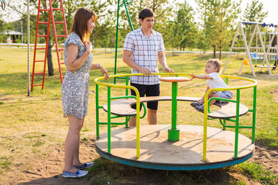 Rear view of people enjoying in park