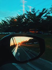 Close-up of side-view mirror of car