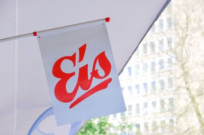 Low angle view of flag against building