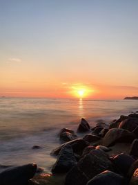 Scenic view of sea against sky during sunset