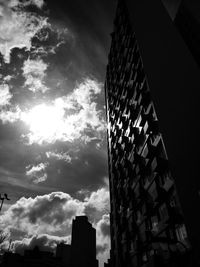 Low angle view of building against cloudy sky