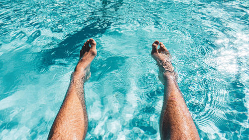 Low section of people in swimming pool