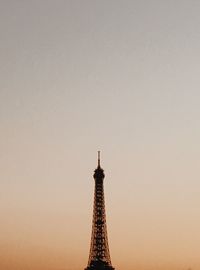 Tower in city against sky