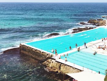 High angle view of people on swimming pool