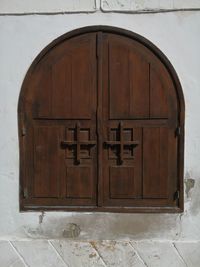 Closed wooden door of old building