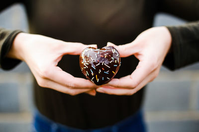 Close-up of woman holding hands