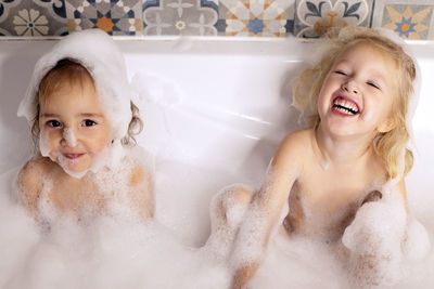 High angle view of young woman in bathtub