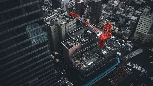 High angle view of illuminated buildings in city at night