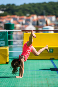 Girl doing stunt in boat