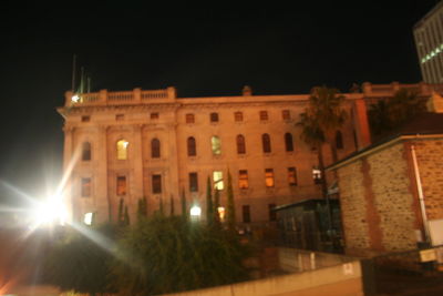 Buildings in city at night