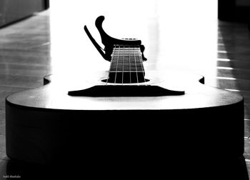 Close-up of guitar in the dark