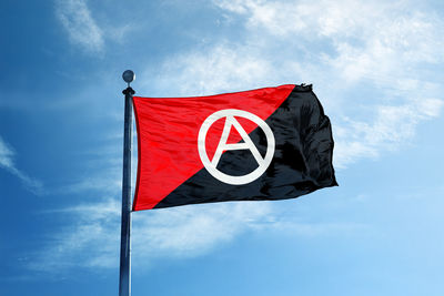 Low angle view of flag against sky