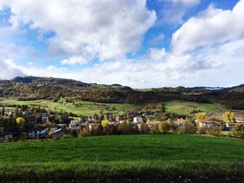 Scenic view of agricultural field against sky