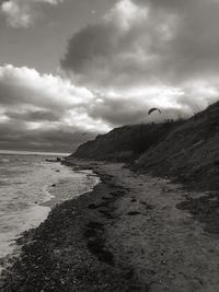 Scenic view of sea against cloudy sky