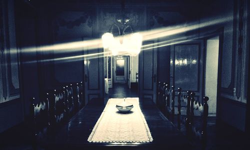 Illuminated lamp post at night