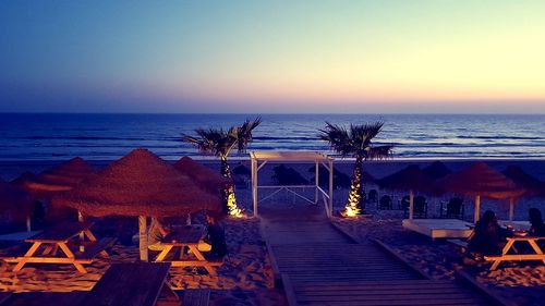 Scenic view of beach at sunset