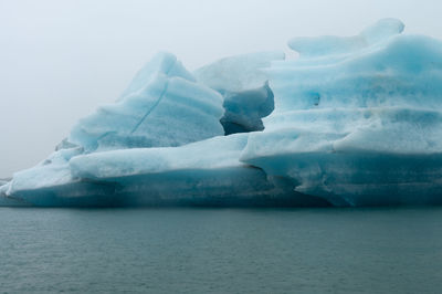 Scenic view of frozen lake against sky