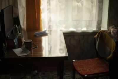 Young woman reading book at home