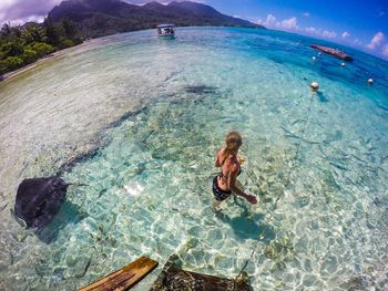 High angle view of woman swimming in sea