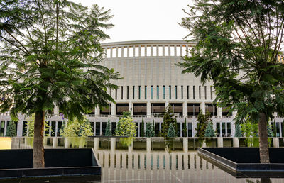 View of swimming pool by building