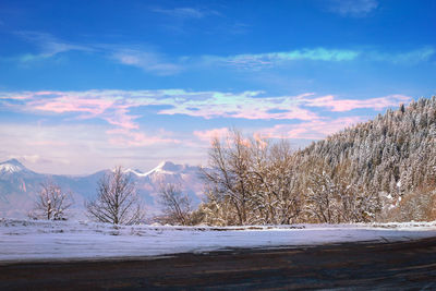 Scenic view of snowcapped mountains against sky