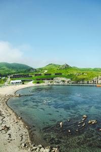 Scenic view of beach against blue sky