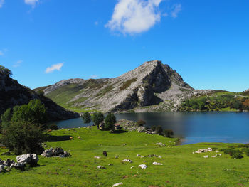 Scenic view of lake and mountains against sky