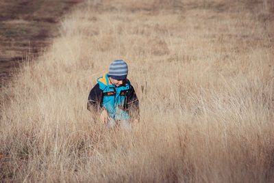 Boy on grassy field