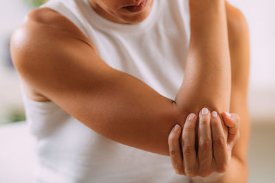 Elbow pain. woman with painful elbow.