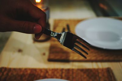 Close-up of person preparing food on table