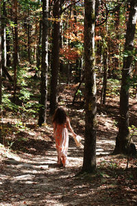 Girl walking through the woods