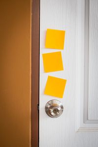 Close-up of blank adhesive notes on door