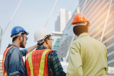 Rear view of men working