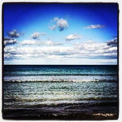 Scenic view of sea against cloudy sky