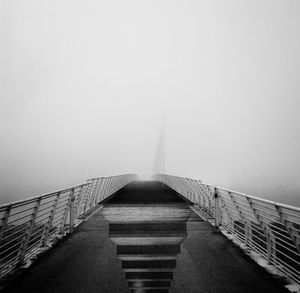 Empty bridge against sky