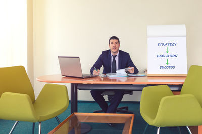 Man working on table in office