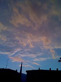 Low angle view of building against sky at sunset