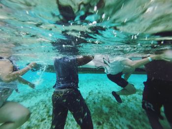 Cropped image of people undersea