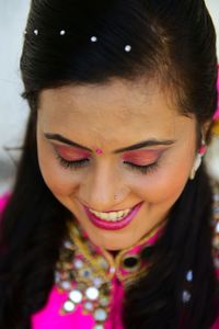 Close-up portrait of a smiling young woman