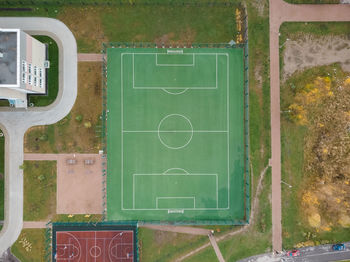 View from above on empty football field. white lines on green lawn. ground for playing in soccer. 