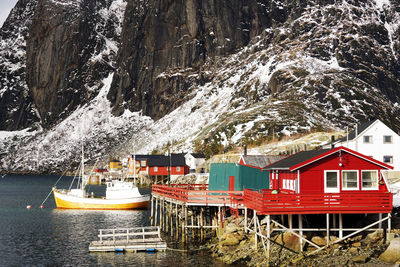 Panoramic view of buildings against mountain during winter