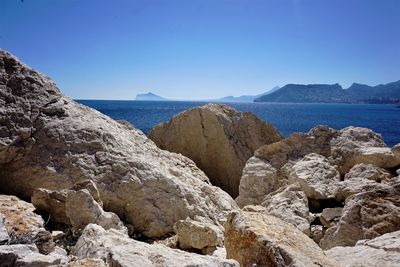 Scenic view of sea against clear blue sky