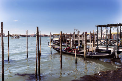 Boats moored at dock