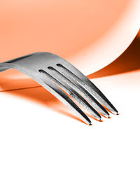 High angle view of fork over white background