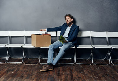 Young man sitting on table